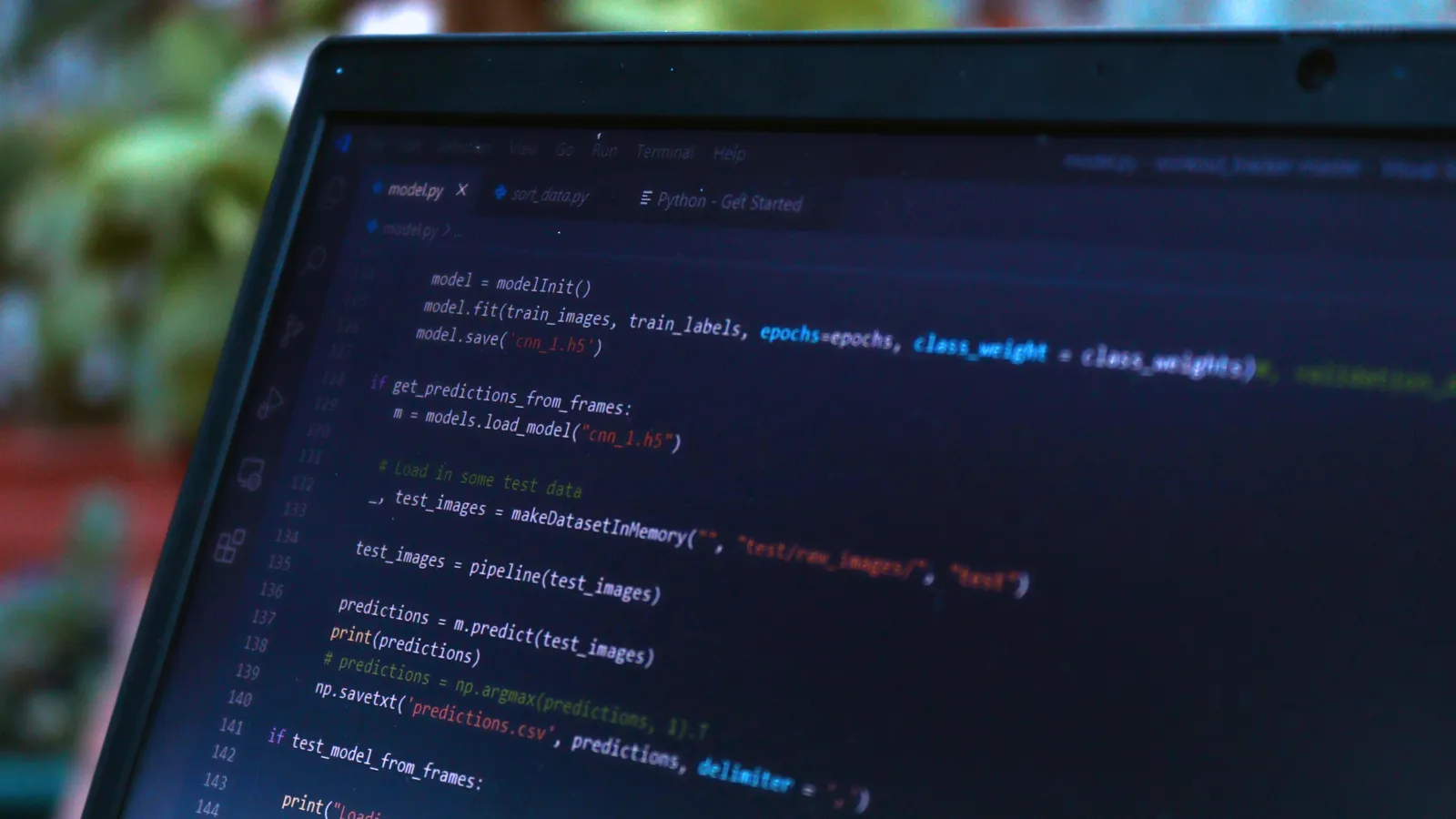 Python machine learning code on a laptop screen