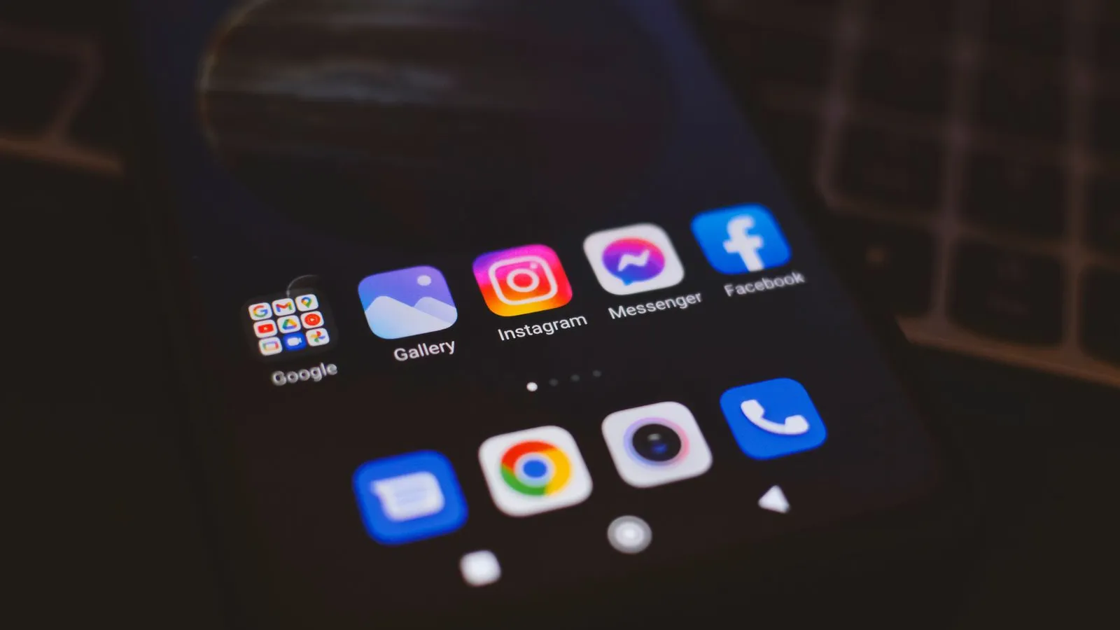 Social media app icons on a smartphone screen