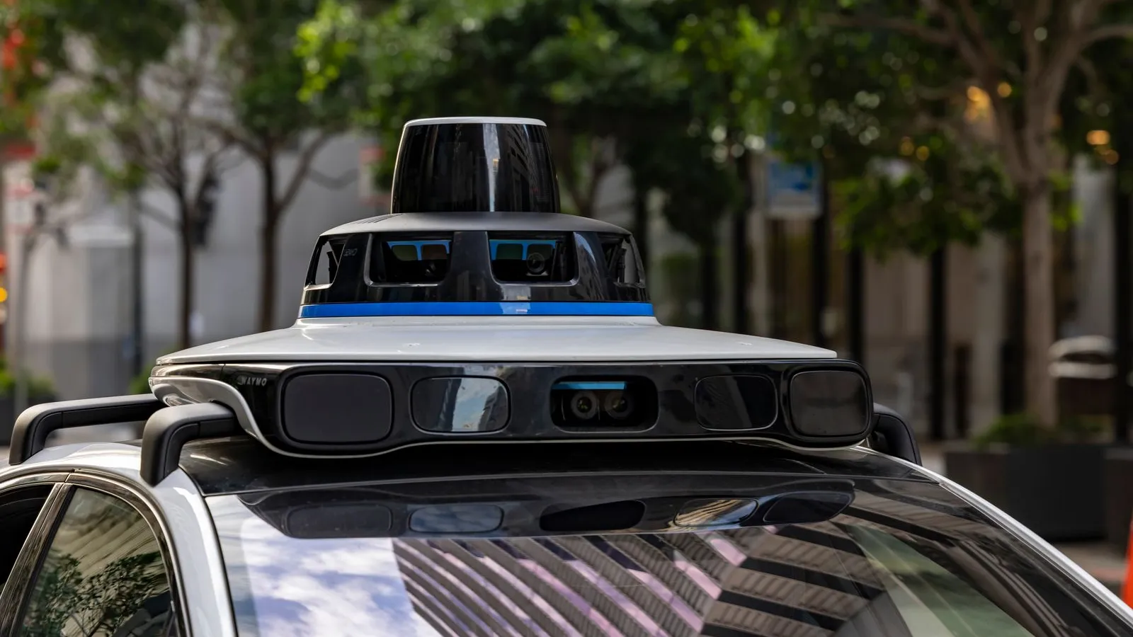 Close-up of the sensor dome with lidar and cameras on the roof of a robotaxi