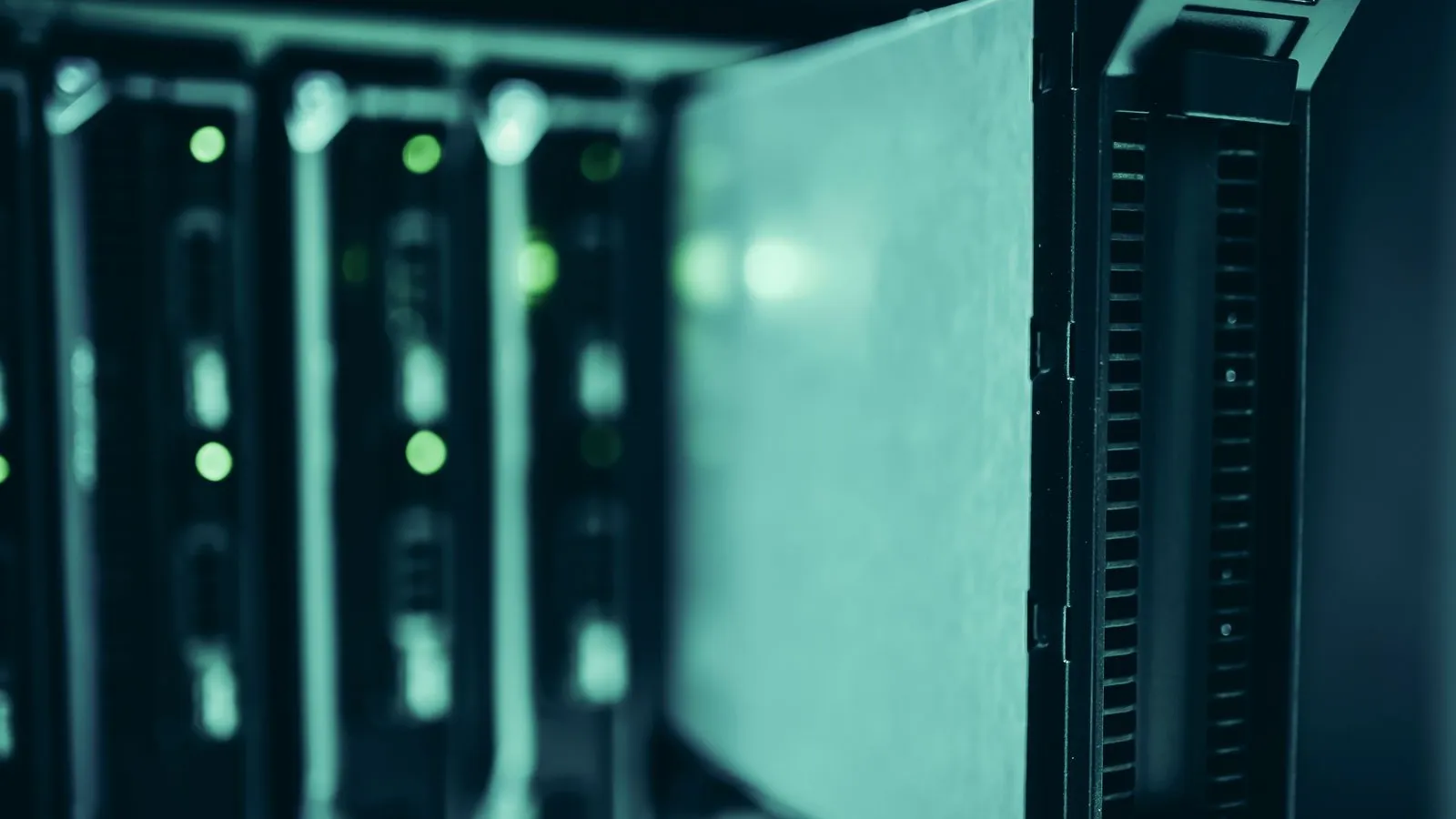 Rack servers with green status lights in a data center
